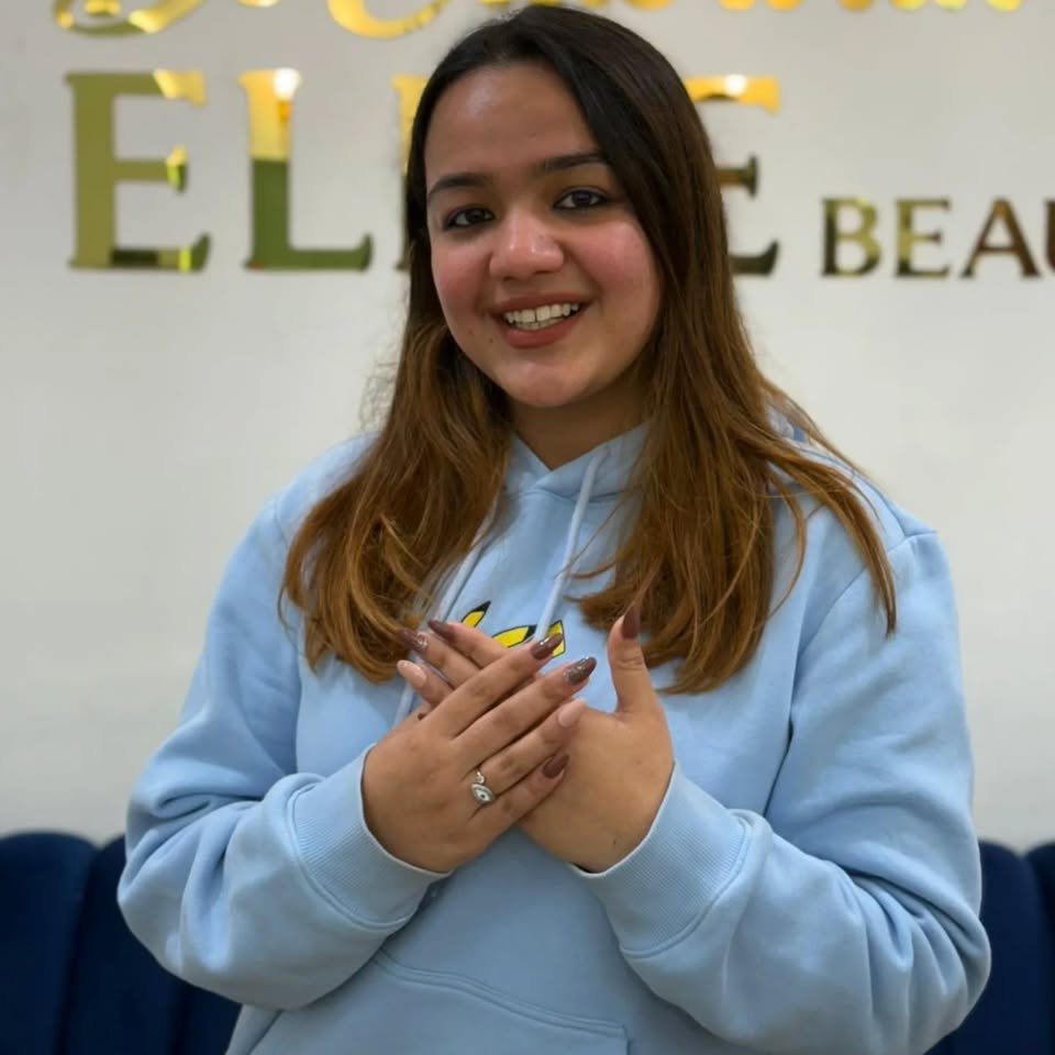 Happy client at Elite Beauty